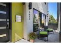 Inviting front porch with comfortable seating, a potted plant and view of the address at 3453 Navajo St, Denver, CO 80211