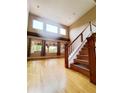 Spacious living room featuring tall ceilings, large windows, and hardwood floors at 10154 Fairgate Way, Highlands Ranch, CO 80126