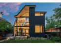 Contemporary home boasting a unique architectural design with expansive windows and a lush green lawn at 360 S Ogden St, Denver, CO 80209