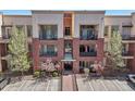 Attractive three-story condo building showcasing balconies and easy access parking at 307 Inverness S Way # 307, Englewood, CO 80112