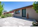View of home's modern front door and stone-tiled front patio at 380 S Jersey St, Denver, CO 80224