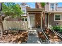 Inviting home exterior with brick accents and well-maintained landscaping at 2092 S Helena St # C, Aurora, CO 80013