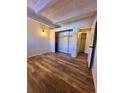 Spacious bedroom with wood-look floors and large closet at 2401 S Gaylord St # 103, Denver, CO 80210