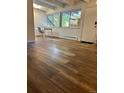 Living room with wood-look floors and a view at 2401 S Gaylord St # 103, Denver, CO 80210