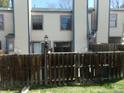 Enclosed backyard with a wooden fence, offering privacy and space for outdoor activities at 453 S Kittredge St # D, Aurora, CO 80017