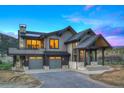 Modern home with a 3 car garage, beautiful exterior, and covered entryway at 294 Gold Run Rd, Breckenridge, CO 80424