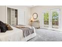 Bright bedroom with a walk-in closet and access to a private balcony with lovely outdoor views at 4603 W 33Rd Ave, Denver, CO 80212