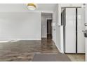 Bright living room with modern laminate flooring and neutral wall paint at 4825 Estes St, Arvada, CO 80002
