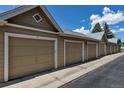Row of private garages providing secure and convenient parking for residents at 6001 Castlegate Dr # A33, Castle Rock, CO 80108