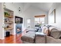 Inviting living room with a vaulted ceiling, fireplace and outside views at 6001 Castlegate Dr # A33, Castle Rock, CO 80108