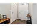 Clean and bright entryway with hardwood floors and storage at 9836 Mount Kataka Pt, Littleton, CO 80125