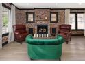 Charming living room featuring a brick fireplace and comfortable seating at 3731 N Race St, Denver, CO 80205