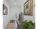Bright entryway with wood-look floors and decorative accents at 697 N Bersshine Ct, Watkins, CO 80137