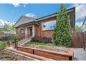 Beautifully landscaped front yard and exterior of home with a modern garden bed at 2539 N York St, Denver, CO 80205