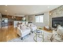 Bright and inviting living room with stylish furniture, a stone fireplace, and natural light at 2539 N York St, Denver, CO 80205