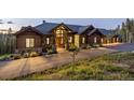 Inviting home featuring wood accents, stone details and a long driveway at 242 Point View Pl, Breckenridge, CO 80424