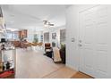Bright, open-concept living space with modern finishes and wood-look flooring at 22044 E Jamison Pl, Aurora, CO 80016
