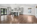 Spacious kitchen with stainless steel appliances, gray cabinets, and island at 7123 S Hudson Cir, Centennial, CO 80122