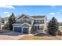 Charming two-story home with a well-maintained yard, three-car garage, and welcoming front porch at 1929 Baguette Dr, Castle Rock, CO 80108