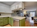 Well-maintained kitchen seamlessly flows into the living room at 14211 E Hawaii Cir # A, Aurora, CO 80012