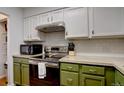Modern kitchen with stainless steel appliances and ample counter space at 14211 E Hawaii Cir # A, Aurora, CO 80012