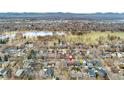 Beautiful aerial view shows the home's location near a park, lake, and other neighborhood residences at 1034 S Williams St, Denver, CO 80209