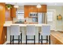 This kitchen offers seating at the island, wood cabinets, and stainless steel appliances at 2665 S Pennsylvania St, Denver, CO 80210