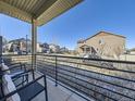 View from a cozy front porch, showcasing the neighborhood street and surrounding homes at 3744 Celestial Ave, Castle Rock, CO 80109