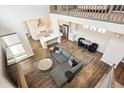 Open-concept living area with modern furnishings and an attached kitchen with stainless steel appliances at 10557 Eby Cir, Lone Tree, CO 80124
