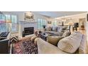 Comfortable living room with fireplace and neutral tones at 5988 E Jamison Ln, Centennial, CO 80112