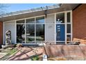 Close-up of the home's front entrance, highlighting the modern door and architectural details at 3895 Chimayo Rd, Littleton, CO 80123
