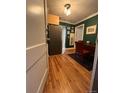 Open dining area featuring hardwood floors and a view into the galley kitchen at 1024 E 14Th Ave # 2, Denver, CO 80218
