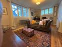 Inviting living room with vintage rug, bright natural light and decorative pillows at 1024 E 14Th Ave # 2, Denver, CO 80218