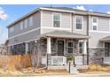 Attractive home with stone accents, a covered front porch, and well-kept landscaping at 21823 E 8Th Ave, Aurora, CO 80018