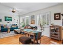 Inviting living room with hardwood floors, ample seating, and bright natural light at 2244 Fenton St, Edgewater, CO 80214