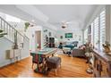 Bright living room with hardwood floors, comfortable seating, and decorative accents at 2244 Fenton St, Edgewater, CO 80214