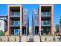 Stunning exterior featuring three-story units with brick columns and modern design at 1821 N Grove St, Denver, CO 80204