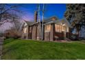 Beautiful brick house with a well maintained lawn and a classic architectural design at 2455 Lowell Blvd, Denver, CO 80211