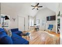 Bright living room with hardwood floors, vaulted ceilings, and a comfortable blue sofa at 103 Sunset St # A, Longmont, CO 80501