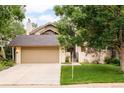 Two-story home with mature landscaping, private entry, and attached two-car garage at 40 S Dexter St, Denver, CO 80246