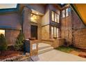 Charming front entrance with brick accents and inviting stairway at 5034 E Otero Cir, Centennial, CO 80122