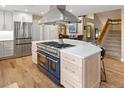 Contemporary kitchen island with cooktop, oven, and plenty of storage space at 5034 E Otero Cir, Centennial, CO 80122