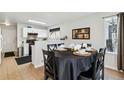 Dining area with a round table and a view of the adjacent kitchen at 5425 W 115Th Pl, Westminster, CO 80020