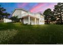 Exterior shot of home with deck, showcasing the home's architectural style and backyard at 723 Brussels Dr, Parker, CO 80138
