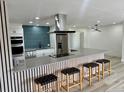 Bright kitchen with an expansive island, stainless steel appliances, and contemporary finishes at 2320 S Valley Hwy, Denver, CO 80222