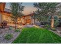 Outdoor space with a fire pit and seating, perfect for enjoying the backyard at 2571 Hunters Pl, Highlands Ranch, CO 80129