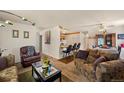 Open living room with comfortable seating and kitchen views at 220 S Julian St # C, Denver, CO 80219