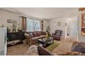 Living room with comfy seating and large window at 220 S Julian St # C, Denver, CO 80219