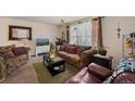 Cozy living room featuring a couch, armchair, and coffee table at 220 S Julian St # C, Denver, CO 80219