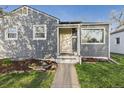 Close-up of a well-maintained home featuring a welcoming front entrance and tidy landscaping at 940 Hooker St, Denver, CO 80204